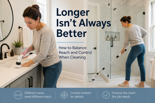 Woman comparing short and extended cleaning tool reach while cleaning a modern bathroom